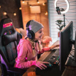 Girl plays video game online and streaming at home
